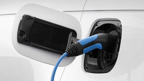 Close up of an electric vehicle being charged up