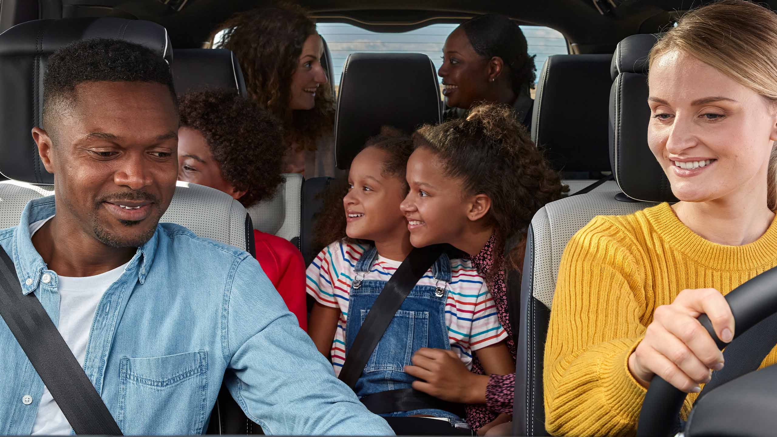 Family driving in Range Rover vehicle